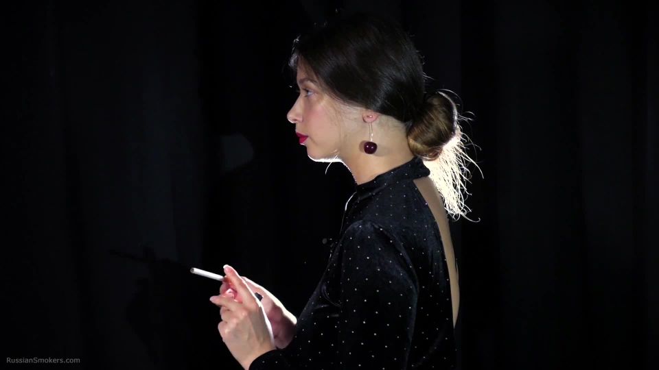 Irina is smoking 100mm cigarette in the dark room RussianSmokers