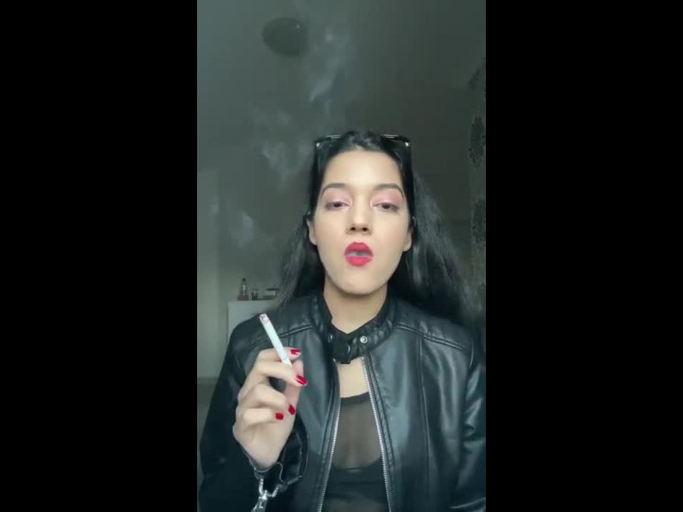 Angie Smoking a cigarette in leather live chatting with you